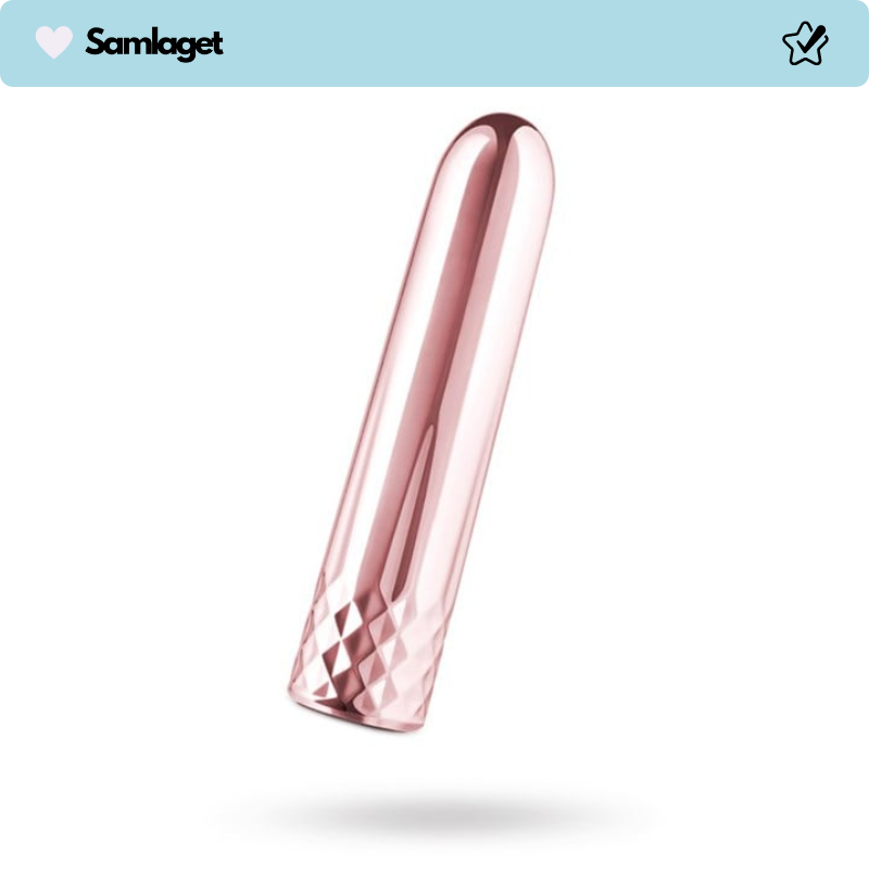 En roséguldfärgad, cylindrisk och slät klitorisvibrator med diamantmönstrad botten.