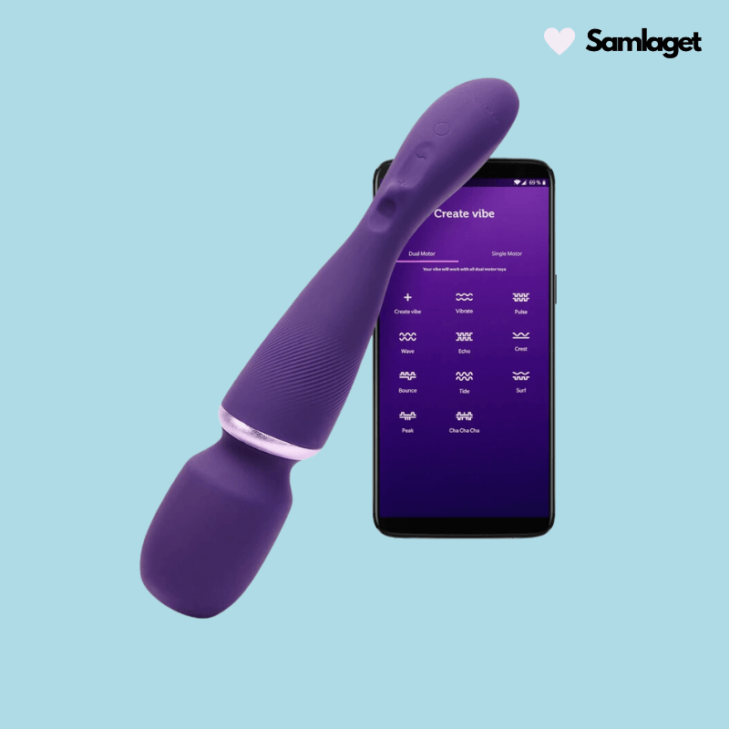 En lila We-Vibe Magic Wand vibrator bredvid en smartphone med appen öppen på skärmen, allt mot en ljusblå bakgrund.